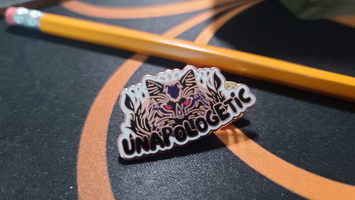 Unapologetic Black Cat enamel pin featuring Ego Cat
